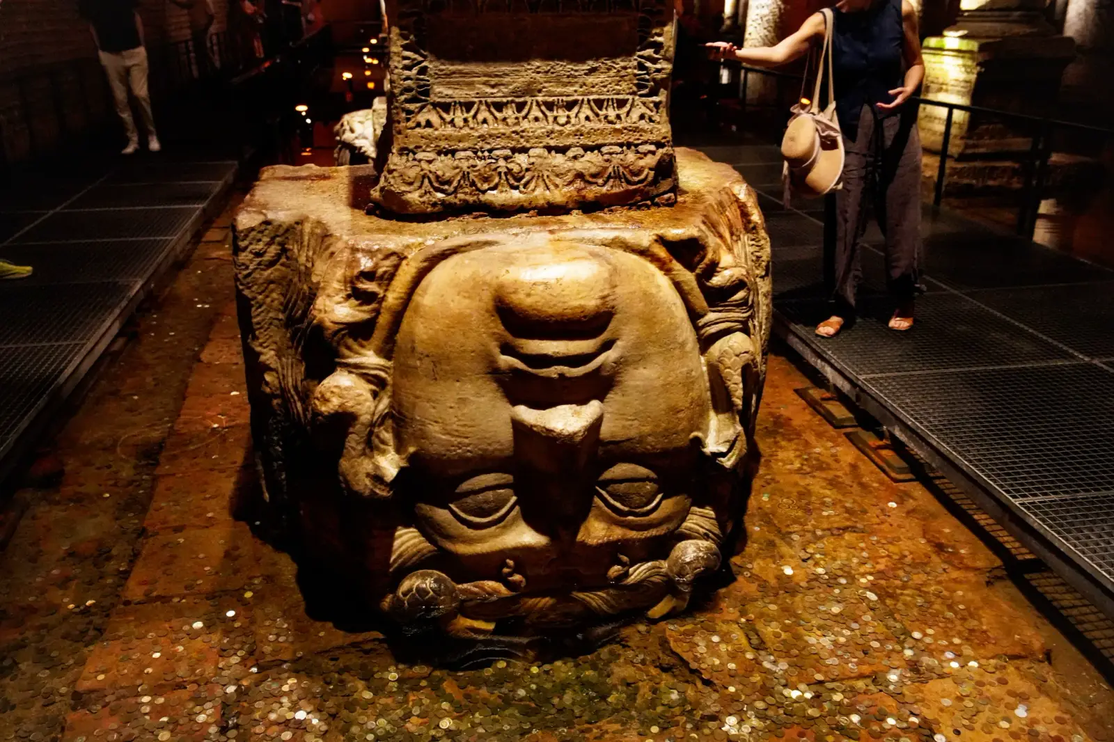 Carved stone head of Medusa placed upside down as a column base